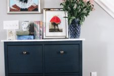 DIY navy IKEA Hemnes shoe cabinet with a marble tabletop