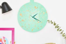 DIY mint and gold speckled clock of a chopping board