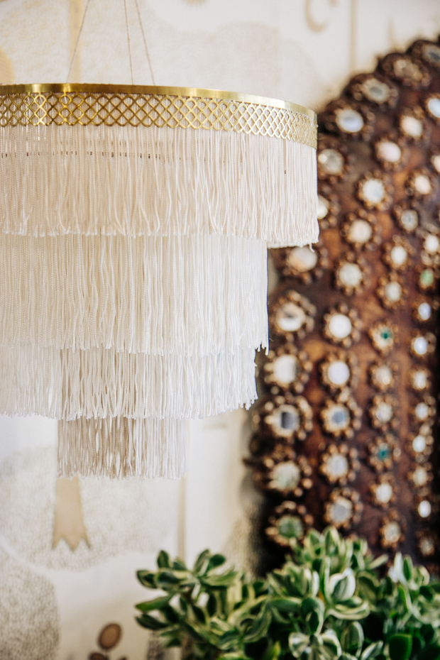 DIY layered neutral and gold fringe chandelier