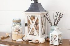 06 lanterns and jars filled with sand and seashells will bring a beachy feel and make you remember your holiday