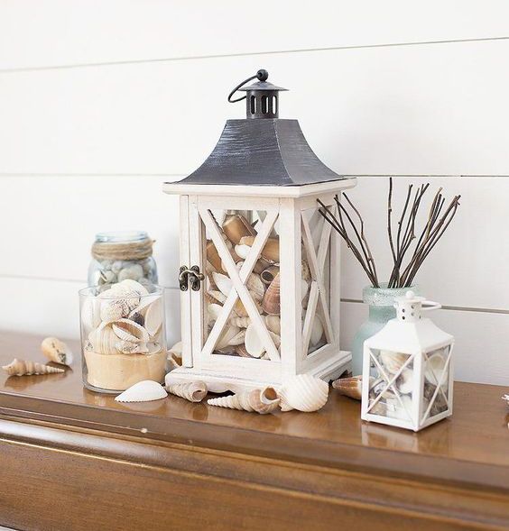 lanterns and jars filled with sand and seashells will bring a beachy feel and make you remember your holiday