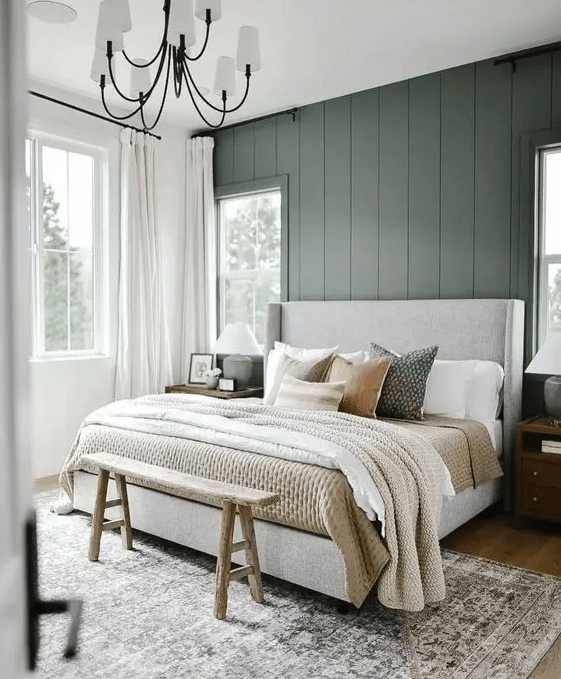 a cozy green and white bedroom
