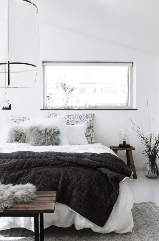 an airy bedroom done in white and accented with light greys can be spruce dup with black touches anytime – just add a black blanket or bedding