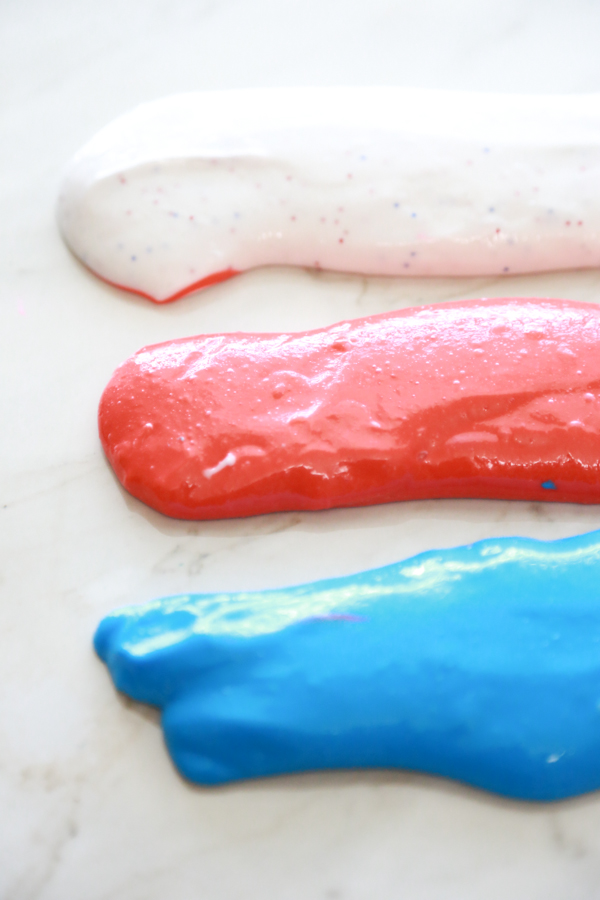 DIY bright Patriotic slime with a touch of glitter (via simplybeingmommy.com)