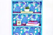 DIY super bright bookcase makeover using wallpapers