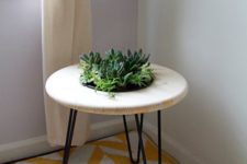 04 a chic side table with hairpin legs and a built-in planter in the center will refresh your space at once