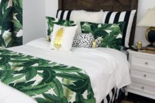 05 tropical leaf prints on the bedding and curtains are easy to add a bold summer look to the bedroom