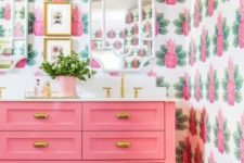 12 a cheerful bathroom done with pink pineapple print wallpaper and a bright pink vanity