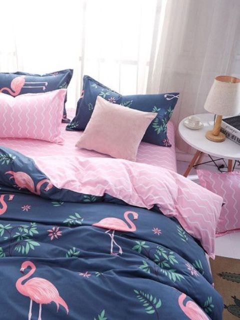 a bright bedding set in navy and pink with a flamingo print is a gorgeous idea for summer