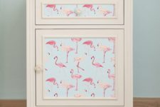 21 self adhesive, removable wallpaper with a pink flamingo print will make your nightstand more summer-inspired