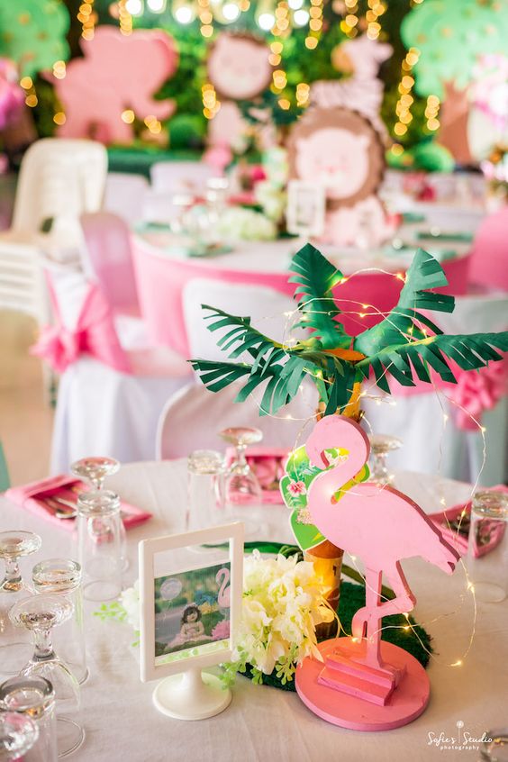 a tropical girl's birthday party done in pink and bright green, with flamingos and other birds and animals