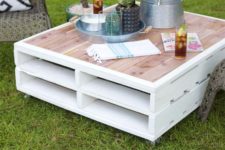 cute DIY pallet coffee table with a pink tabletop