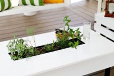 DIY patio coffee table with a herb garden integrated
