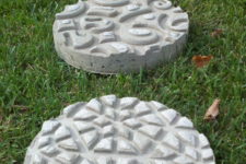 DIY concrete stepping stones embossed with doormats