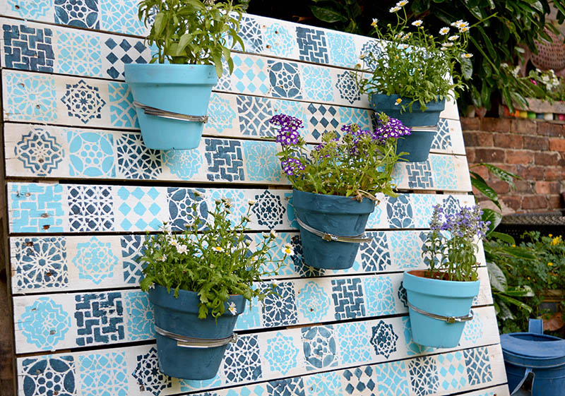 DIY painted wood pallet garden with a Moroccan pattern