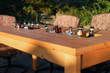 DIY outdoor dining table with a drink cooler