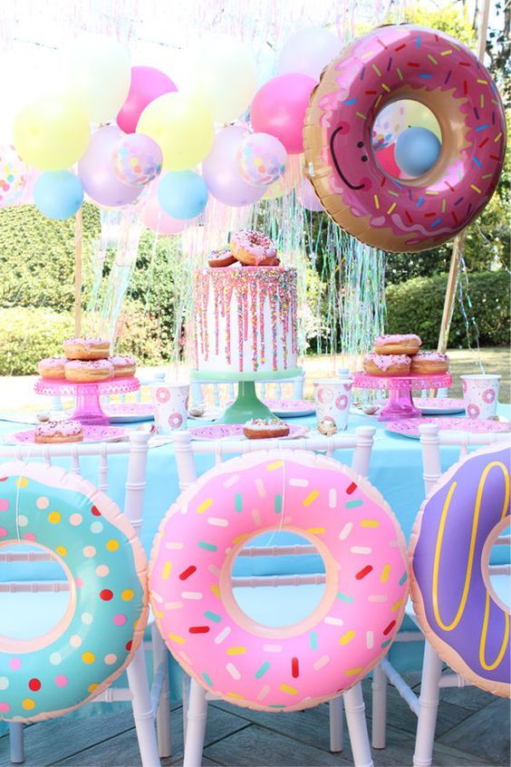 super bright, fun and sweet girl's birthday party theme - glazed donuts, for decor and for the dessert table, too
