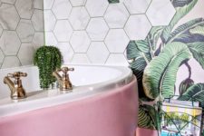 03 a glam bathroom with a palm leaf print wallpaper and marble hexagon tiles plus a pink tub