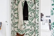 05 a Nordic entryway with a botanical print wallpaper statement wall that spruces up the space