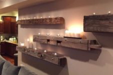 06 rough wooden beams attached to the wall with lots of candles and lights are amazing to create a mood in your home