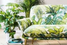 11 a chic botanical love seat on gilded legs and greenery in pots for creating a natural feel