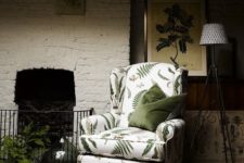 12 a moody living room with a vintage whiet chair with a tropical leaf print that looks old-fahsioned yet modern