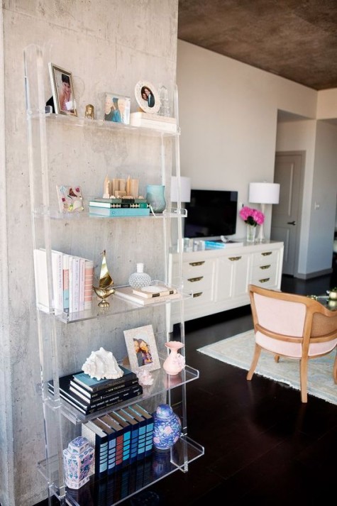 an acrylic shelving unit doesn’t look bulky and accomodates many things, no less than a usual one