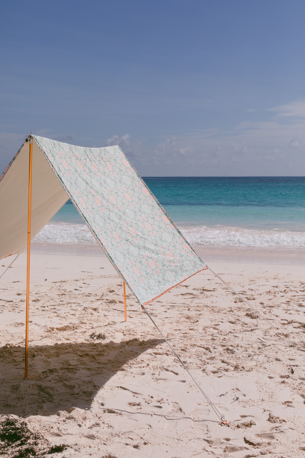 DIY beach tent of fabric and pipes (via ruffledblog.com)