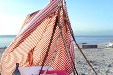 DIY boho beach tent using sticks and a shower curtain