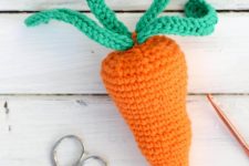 DIY bright crochet carrot baby rattle