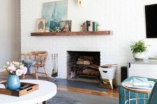 06 a modern farmhouse living room with white brick walls and touches of turquoise and teal
