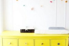 07 an IKEA Hemnes hack in bold yellow with different knobs will make a colorful statement in the nursery