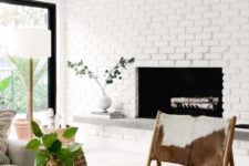 07 white brick walls make the living room feel airy and relaxed and gives a neutral backdrop