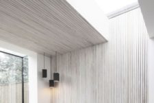 08 a minimalist space with whitewashed wooden planks on the wall and ceiling