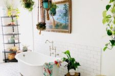 a bright bathroom with a gypsy feel – a bright boho rug, bold towels, potted greeneert and a wicker basket for storage
