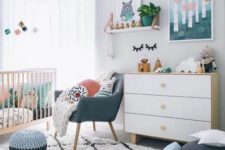 a bright contemporary nursery in white with touches of muted and pastel colors here and there