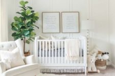 a welcoming creamy nursery with a wicker lampshade, a knit and fur rug, a white chair and baskets for storage