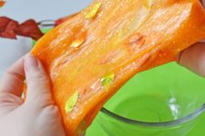 DIY bright orange slime with glitter and leaves