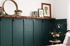 simple dark green wainscoting and white walls create a great vintage farmhouse bedroom