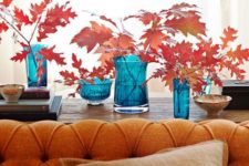 09 bright fall leaves arrangements in contrasting blue vases will make a bold statement in decor