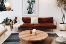 12 a rust-colored velvet sofa is a centerpiece of this boho living room and brings a fall feel here