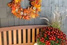 16 a bright fall leaf wreath with pinecones, yarn balls and twigs is a cool idea, and if it’s faux – it’s durable
