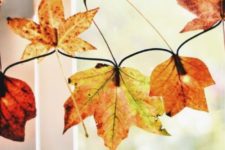 a cool and simple to make fall garland with leaves and lights
