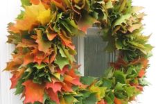20 a super lush fall wreath made of real fall laves of various colors will make a statement both indoors and outdoors