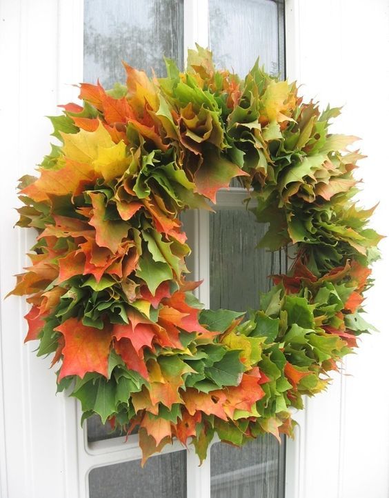 a super lush fall wreath made of real fall laves of various colors will make a statement both indoors and outdoors