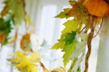 21 accent your window with a fall leaf garland with pumpkins and twine to make it fall-like