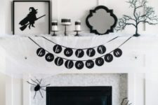 24 an ultra-modern and laconic black and white fireplace with signs, black and white pillows, spiders and banners