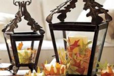 25 lanterns with candles wrapped with fall leaves and a tray will them will make up a cool fall leaf decoration or centerpiece