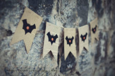 simple DIY Halloween bat bunting with newspaper and buttons