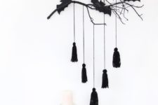 DIY modern Halloween decoration with branches and bats